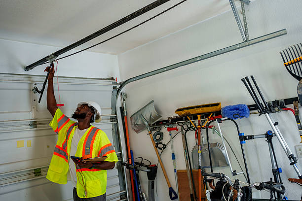 Professional Garage Door Panel Replacement technician working in Newark, NY